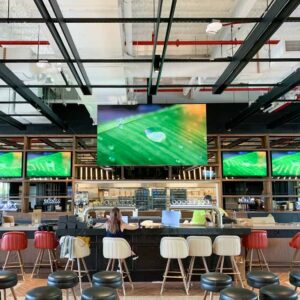 This is an image that showcases an indoor LED Display installed in a restaurant bar as an indoor led commercial display. This is a Hospitality Digital Display Solutions by Metrospec.