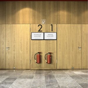 This is an image of an indoor e-paper displays being used to label the entry of two lecture halls from Metrospec's Digital Displays. Digital Signage for Education