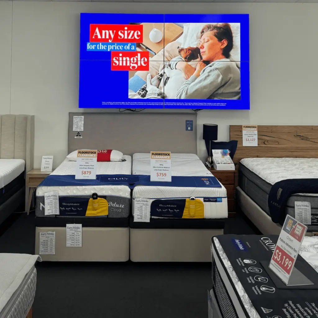 This is an image of an indoor LED display installed in a mattress store.