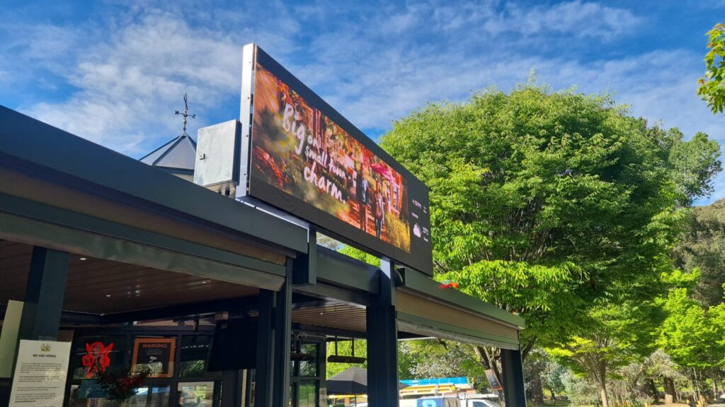 Outdoor LED screen at The Duck Inn displaying fire-danger and weather information